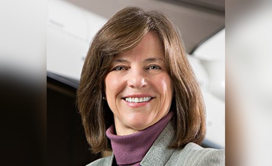 Dr. Bonnie Dunbar, CMS Foundation Board of Directors member and former NASA astronaut, smiling in a gray blazer and purple turtleneck