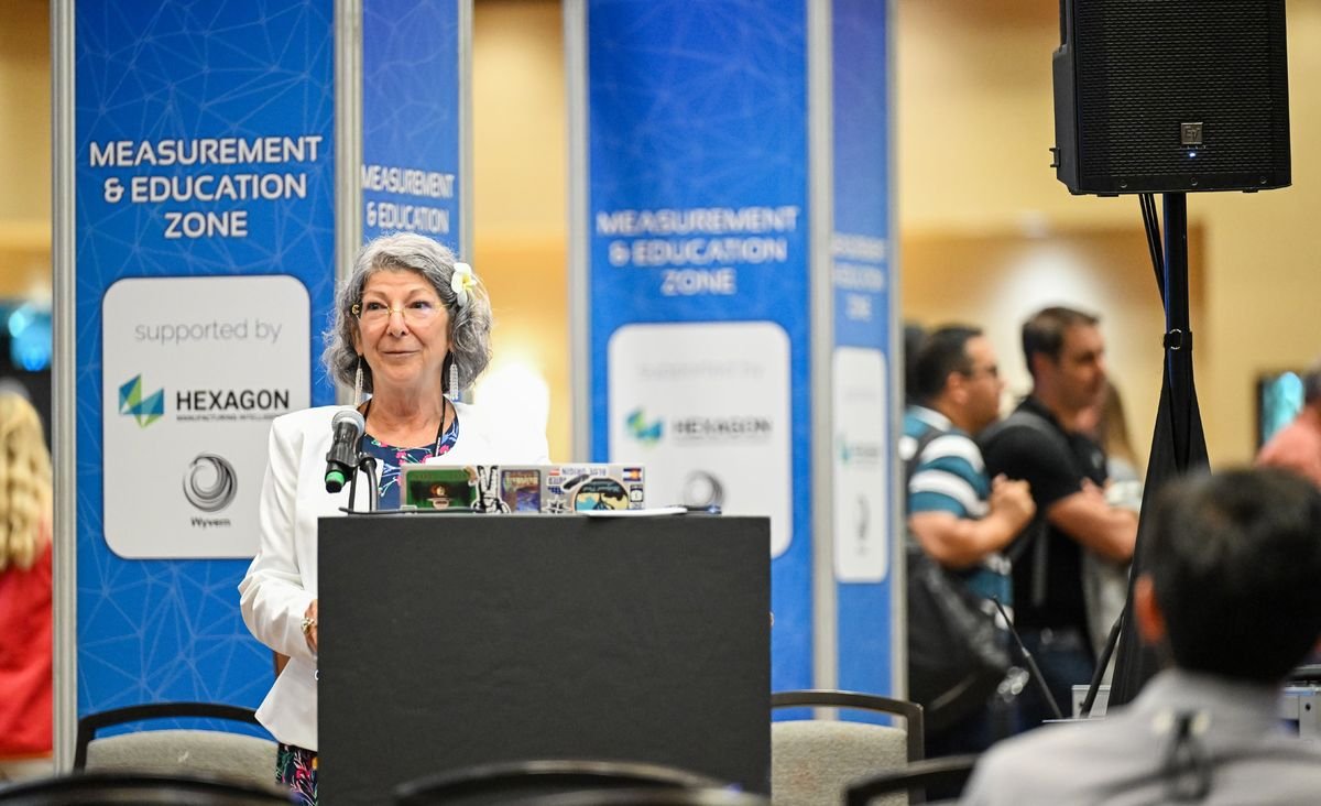 A presenter speaking in the CMSC Measurement & Education Zone