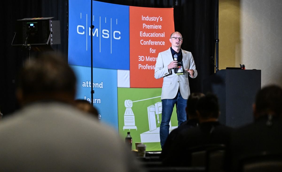 A speaker addressing attendees at the Coordinate Metrology Society Conference, the industry's educational conference for 3D metrology professionals