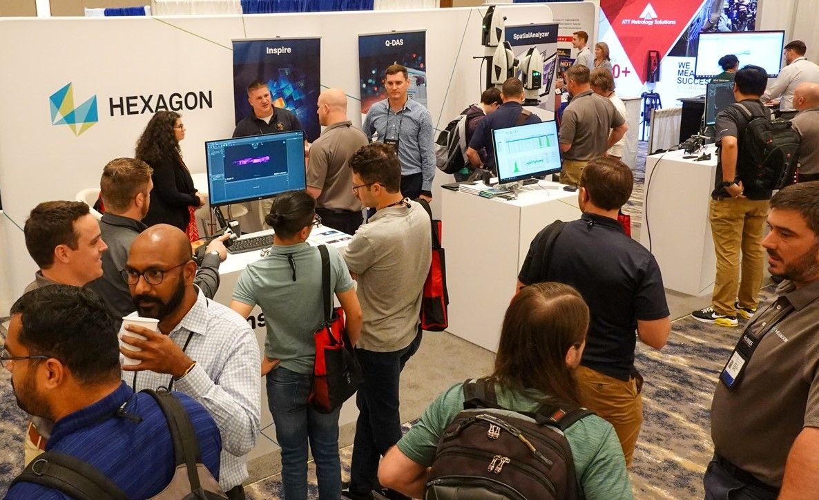 Attendees crowding the CMSC exhibit hall around metrology equipment booths
