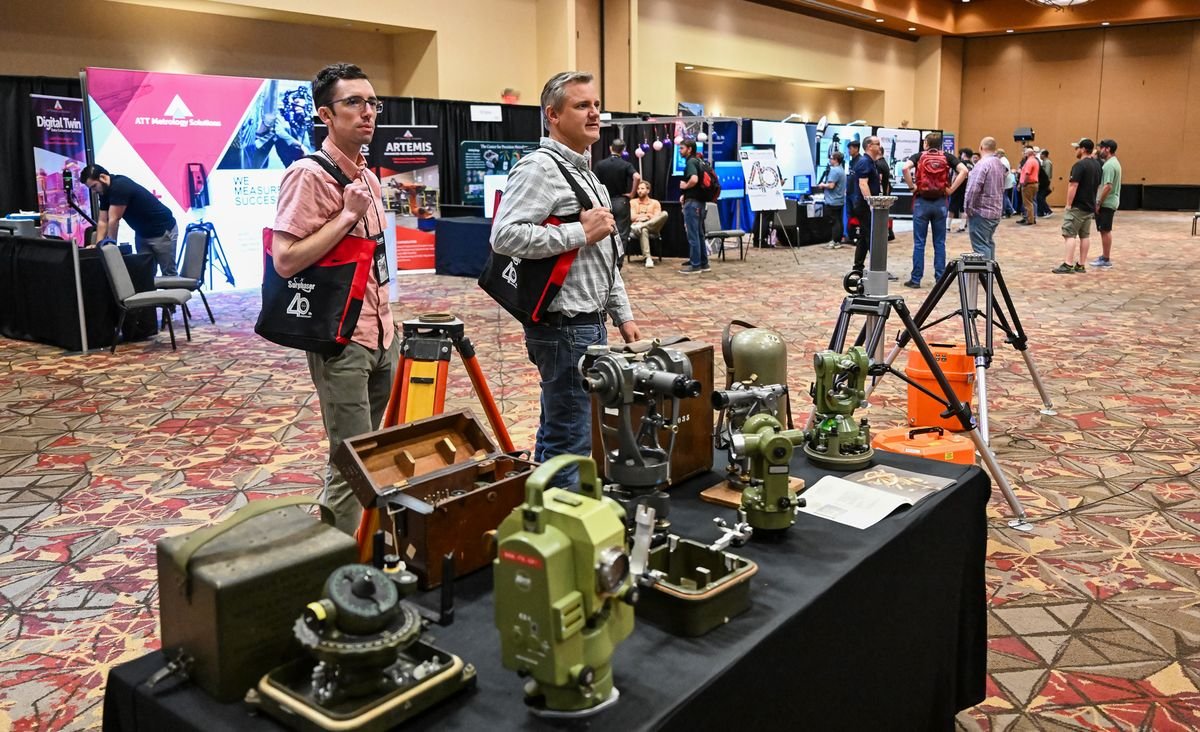 A display of historic surveying and measurement instruments in the CMSC exhibit hall